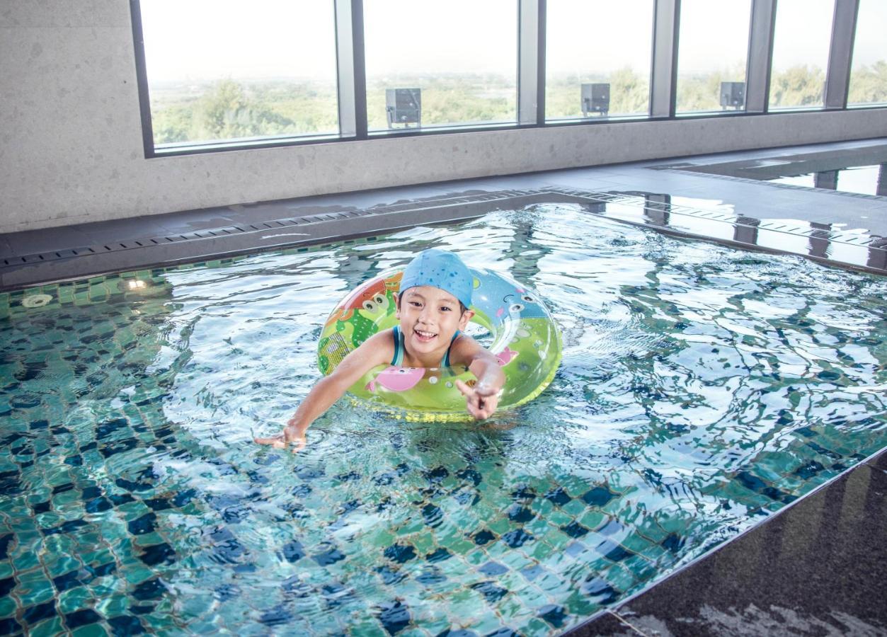 Crowne Plaza Tainan By Ihg Hotel Exterior photo A child swimming with a float